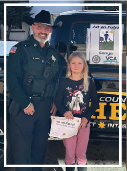Deputy Amaya standing in front of truck with Sonya 